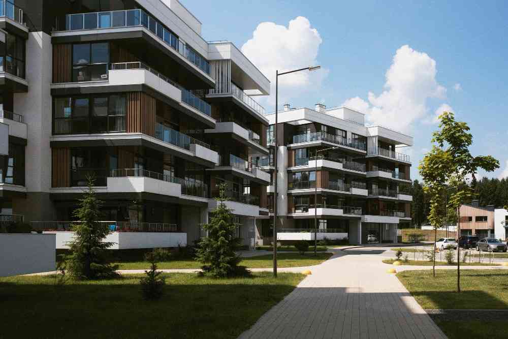 a building with balconies and trees